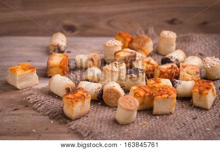 Salty party snacks on natural background. Closeup detail.