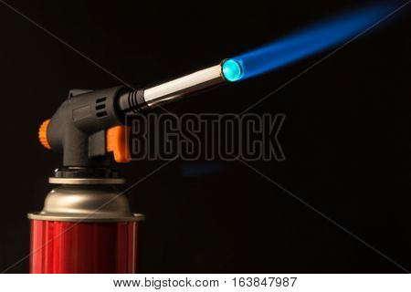 Gas Burner - The Tool Is Lit A Blue Flame