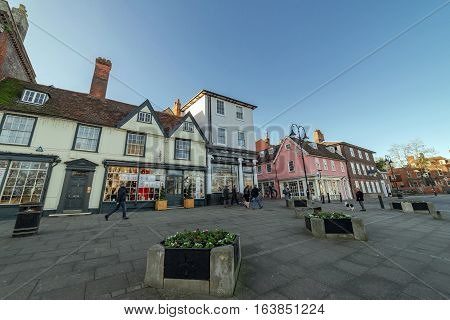 Bury St Edmunds, UK. 26th December 2016. The streets of Bury St Edmunds at Angel Hill by the Abbey Gardens are quiet on a Boxing day late afternoon. A few people are walking along the road.