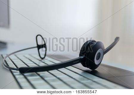 computer headphones on a keyboard of the notebook stock photo no man
