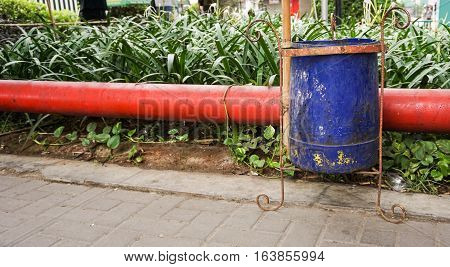 A blue trash can on the roadside photo taken in Semarang Indonesia java