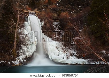Frozen waterfall coming from an old logging flume