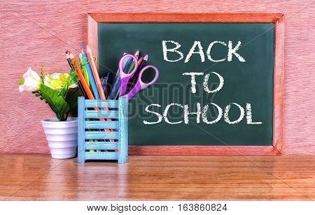 Green school chalkboard with written sentence space
