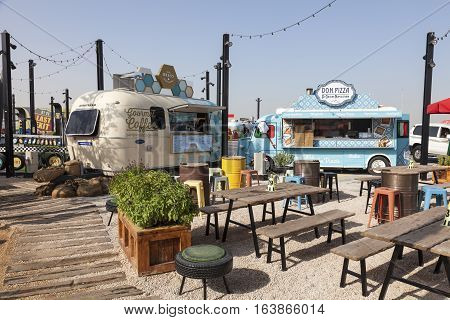 DUBAI UAE - NOV 27 2016: Last Exit food trucks park on the E11 highway between Abu Dhabi and Dubai United Arab Emirates