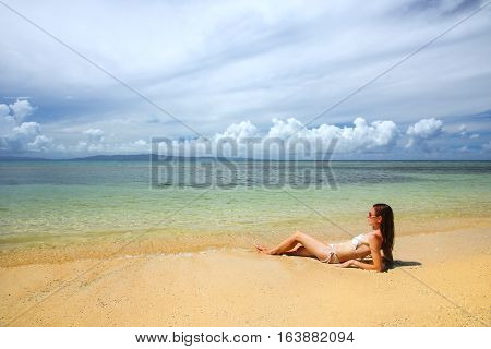 Young Woman In Bikini Lying On The Beach On Taveuni Island, Fiji