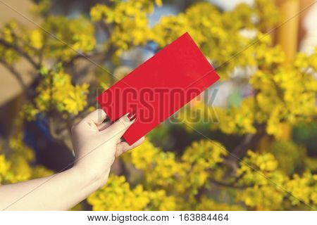 Hand Give Money In Red Envelopes - Ang Pow Or Red Packet To Someone For Chinese New Year / Tet Holid