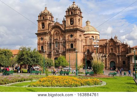CUSCO PERU - JANUARY 20: Iglesia de la Compania de Jesus on Plaza de Armas on January 20 2015 in Cusco Peru. In 1983 Cusco was declared a World Heritage Site by UNESCO