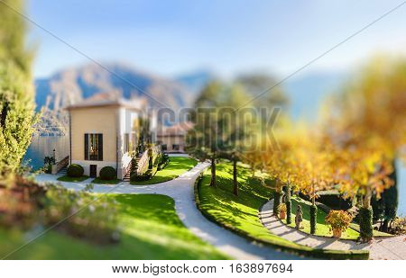 The park of Villa Balbianello in Lenno Lake Como Italy. Miniature tilt shift lens effect.