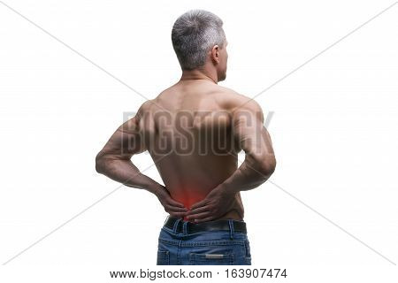 Middle aged man with back pain muscular male body studio isolated shot on white background with red dot