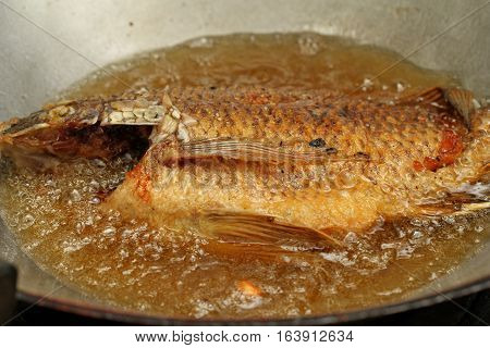 Cooking Of Deep Fried Nile Tiapia Fish.