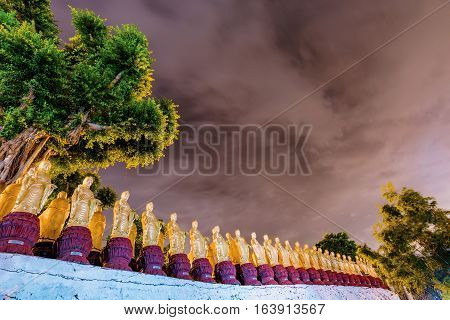 View of gold Buddha statues at night