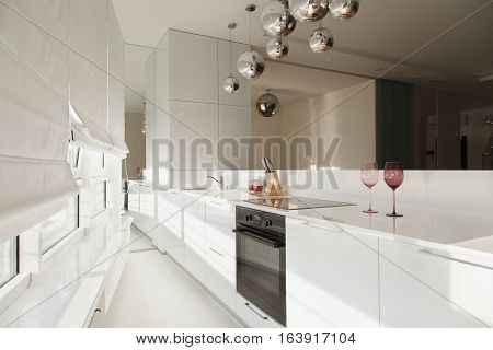 Modern interior studio apartments design in minimalist style and white colors. Interior design in the style of high-tech
