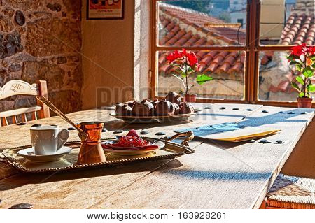 coffee in coffee pot with jam on wooden table