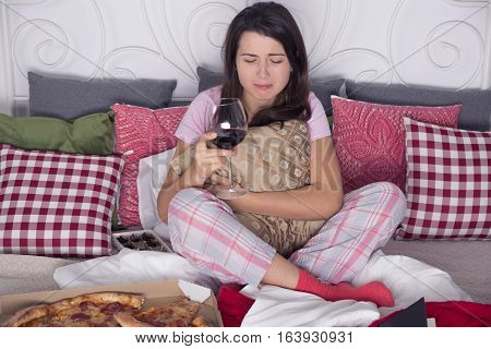 Depressed Woman Sitting On Couch