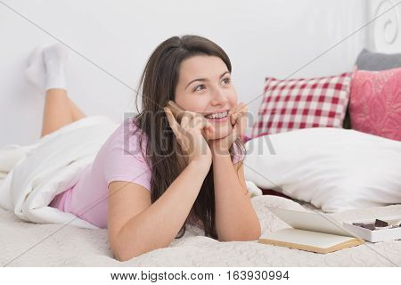 Happy Girl Lying In Bed