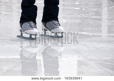 Still capture of recreational figure skater ice skates on outdoo