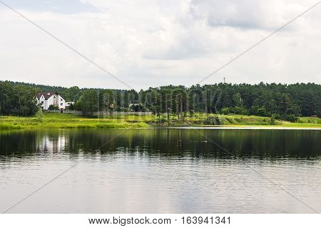 River Karakan the village of Zavyalovo Novosibirsk oblast Siberia Russia - July 7 2016: a view of the ancient Siberian village across the river