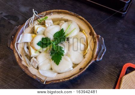 Traditional Shimabara Guzoni - Soup With Rice Cake And Seafood