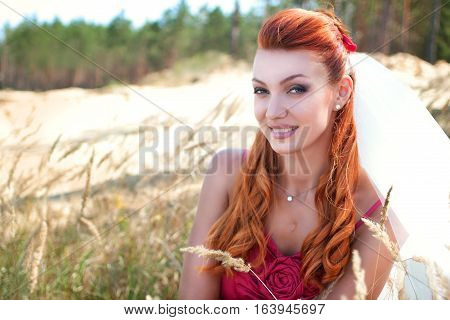 beautiful bride in veil close up outside