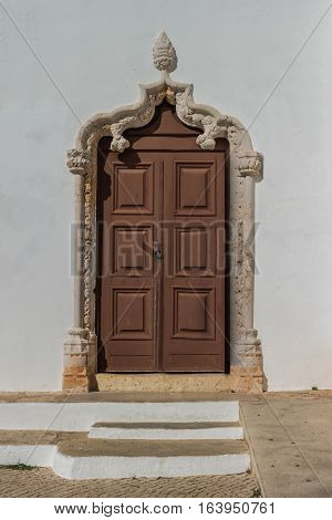 Historically church door of the Alvor Mother Church dedicated to divine Savior Alvor Portugal.