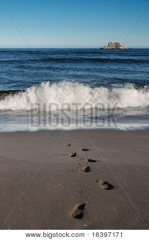 Footsteps at a sea-sand
