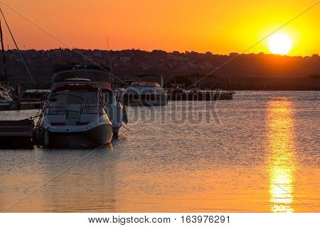 Sozopol, Bulgaria - July 11, 2016: Sunset at the port of Sozopol, Burgas Region, Bulgaria