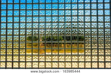 Looking out through a large glass glock window with a semi-smooth center section