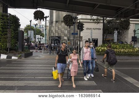 BANGKOK THAILAND - DEC 31 : unidentified tourist walk across road at Erawan shrine at Ratchaprasong Junction while new year Festival on december 31 2016 thailand.