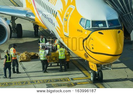 BANGKOK, THAILAND-DEC 29 2016. NOKAIR airline loading cargo on the plane at the gate in Don Mueang international airport (DMK)