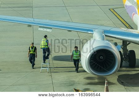 BANGKOK, THAILAND - DEC 29 2016. airport officer and truck Refueling of the aircraft at Don Mueang international airport (DMK)