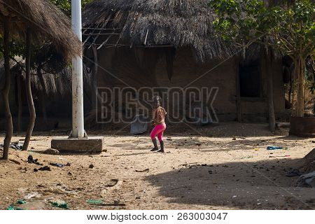 Orango Island, Guinea-bissau - February 3, 2018: Small Baby Girl At The Village Of Eticoga In The Is