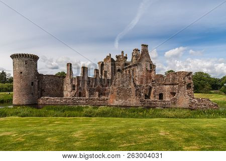 Shearington, Scotland, Uk - June 18, 2012: Long Shot Of South Side Of Ruined  Triangular Brown Stone