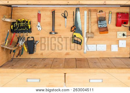 Wooden Workbench At Workshop. Lot Of Different Tools For Diy And Repair Works. Wood Desk For Product