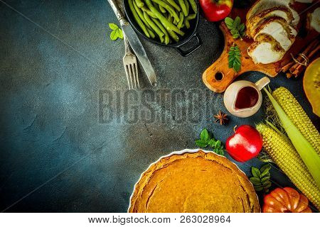Thanksgiving Holiday Table With Traditional Festive Food - Turkey, Pumpkin Pie, Pumpkins, Green Bean