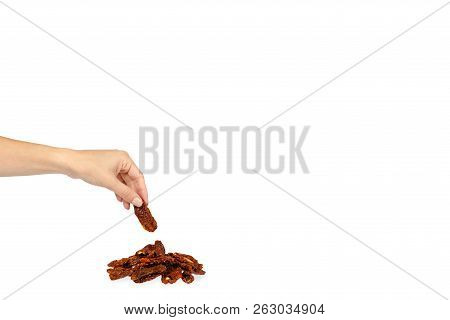 Sun Dried Red Tomatoes With Hand Isolated On White Background, Copy Space Template