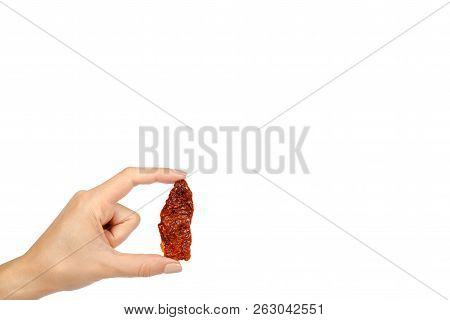 Sun Dried Red Tomatoes With Hand Isolated On White Background, Copy Space Template