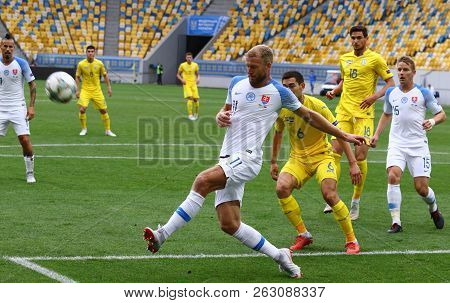 Lviv, Ukraine - September 9, 2018: Ukrainian (in Yellow) And Slovak Players Fight For A Ball During 