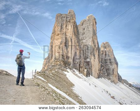 Tourist Walk Drei Zinnen Round Tour.  Tre Cime Di Lavaredo With Hiker Sextener Dolomiten Or Dolomiti