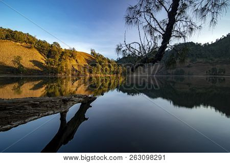 Beautiful Nature Landscape By The Lakeside Will Full Reflection In The Morning.ranu Kumbolo Lake, Se
