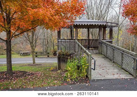 A Wooden Gazebo Surrounded By Autumn Colors In Smithville Village In Nurlington County New Jersey.