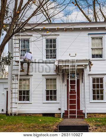 Smithville, New Jersey - November 16 - A Painter Works On A Historic Row Home On November 16 2016 In