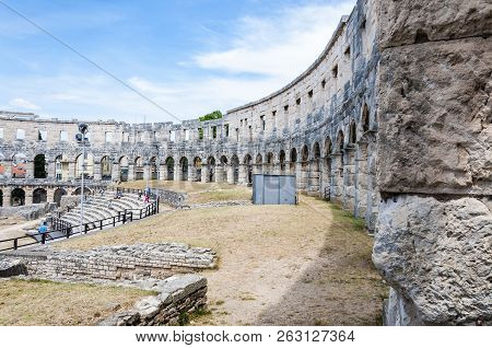 Pula, Croatia - June 18, 2014: Stone Arc Columns Rows In Pula Arena. The Most Famous And Important M