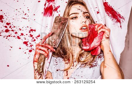 Scary Woman With Blood On Face Holding A Rusty And Bloody Cleaver And Meat In Front Of Her Face. Sex