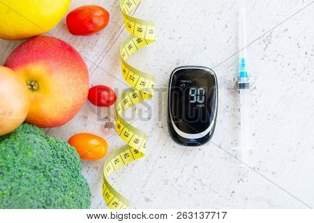 Diabetes Healthy Diet Concept, Raw Vegetables With Blood Glucose Meter And Insulin Syringe