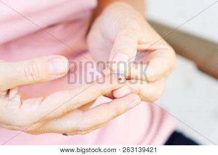 Someone Measuring Blood Sugar Level, World Diabetes Day Concept