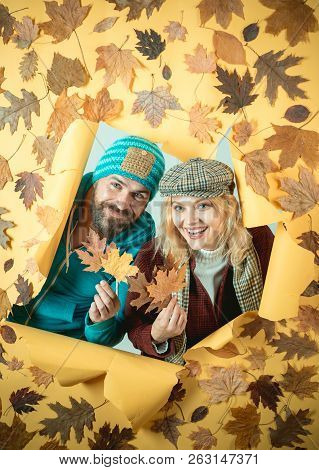 Bearded Man And Pretty Woman On Yellow Background. Romantic Couple Wearing Pullover On Autumn Leaves