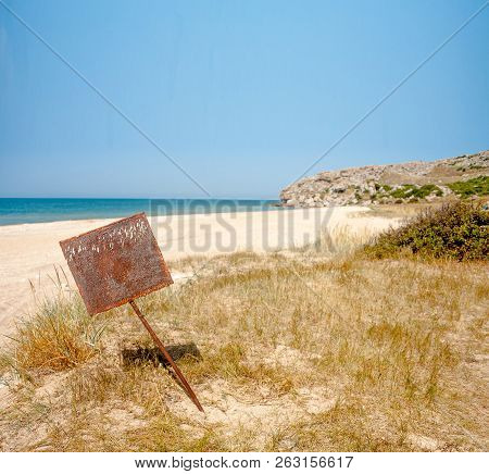 Rusty Blank Metal Bunner On Desert Sandy Coast Near Sea, Crymea, Russia