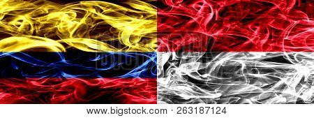 Colombia Vs Monaco, Monacan Smoke Flags Placed Side By Side. Thick Colored Silky Smoke Flags Of Colo