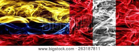 Colombia Vs Peru, Peruan Smoke Flags Placed Side By Side. Thick Colored Silky Smoke Flags Of Colombi