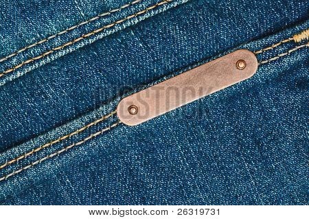 Bronze Metal Etikett auf Blue jeans